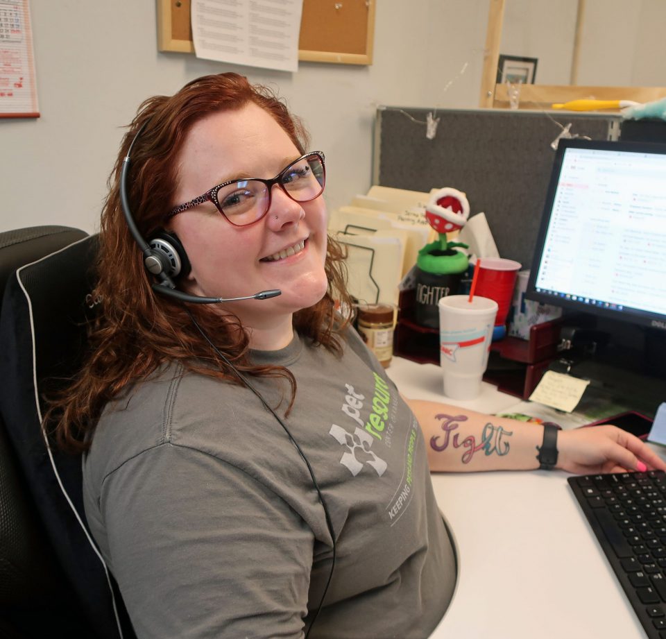 Amanda smiling at the camera, happy to be working in call center