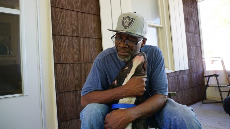 A man hugs his dog