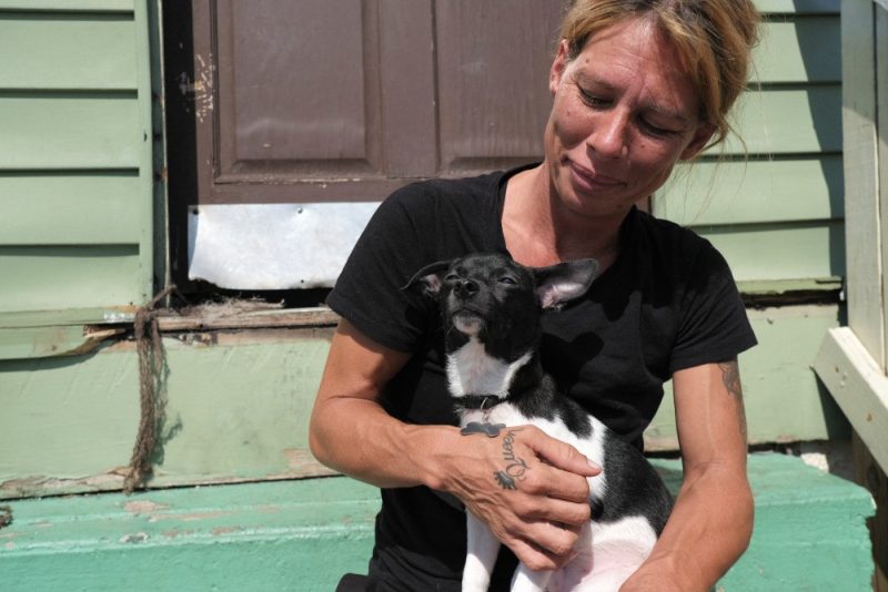 Janet, with her puppy, Maverick, who survived parvo after receiving treatment at PRCKC. 