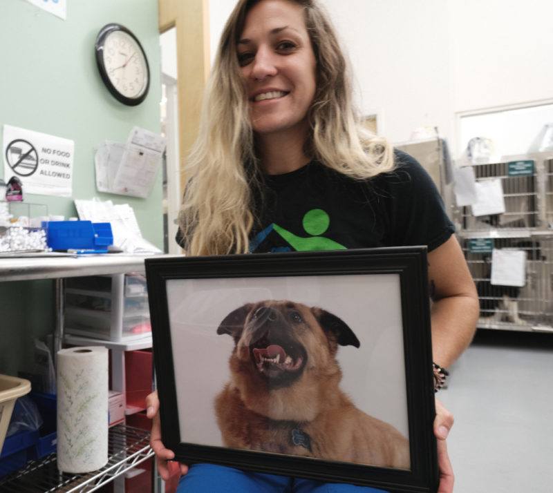 Liz with a photo of her best buddy, Koda the dog. 