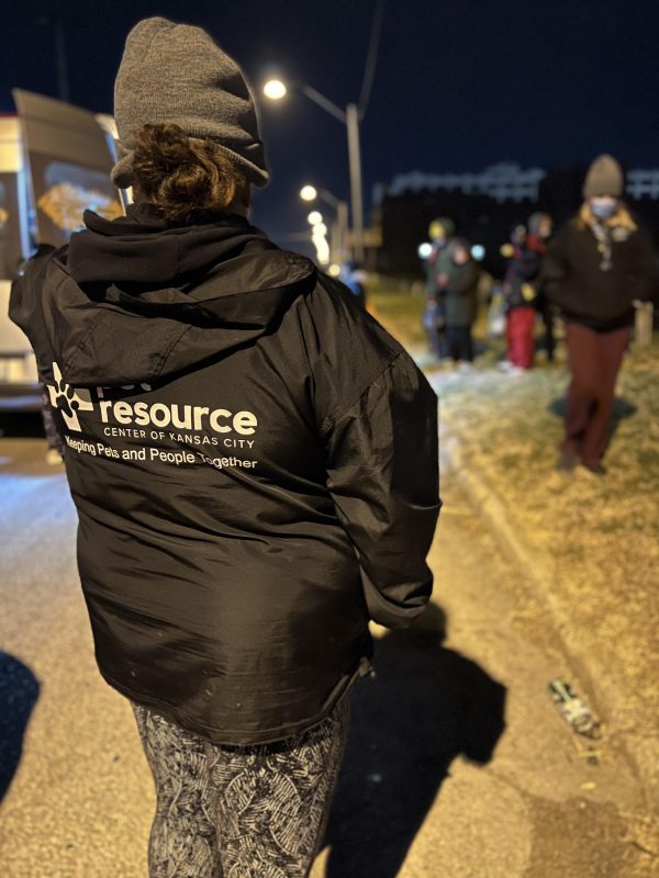 Pet Resource Center staff looking on as Uplift helps people. 