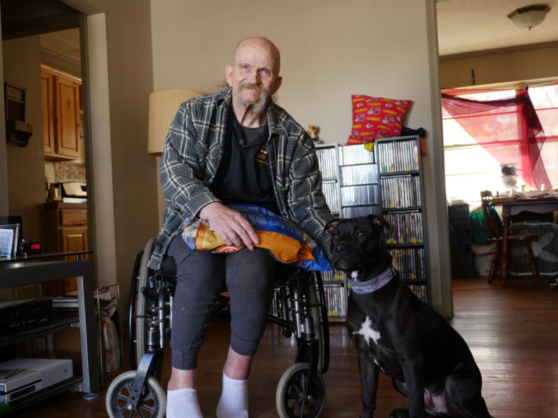 Gary sits with his new friend, Bear, a rambunctious dog with a heart of gold. Gary says Bear saved his life.