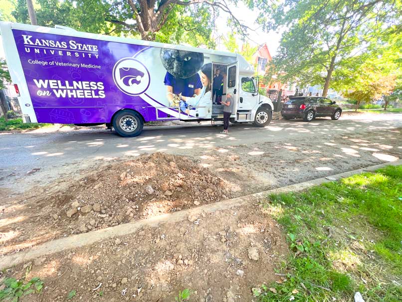 The K-State RV sits on a street in northeast Kansas City